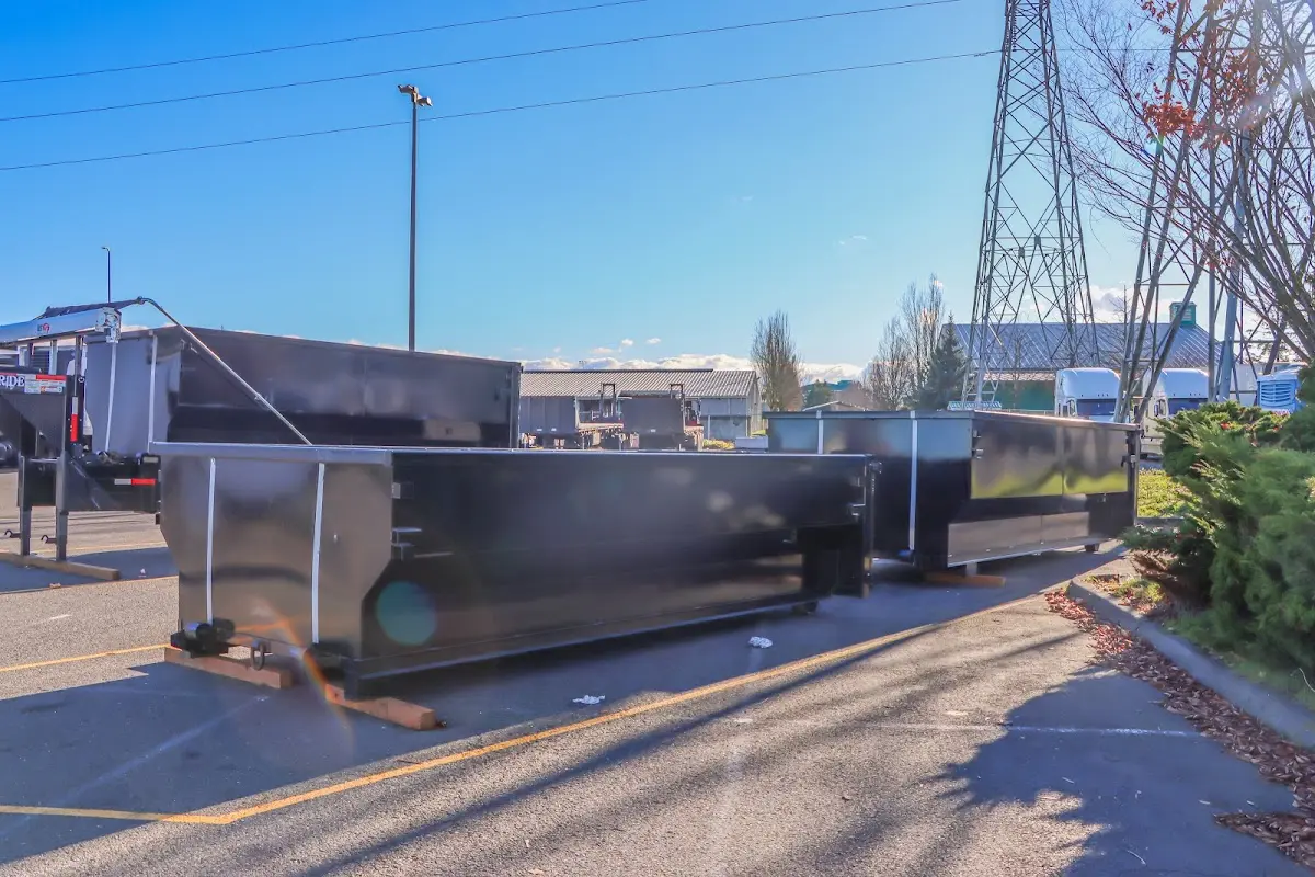 Roll-off dumpster ready for waste disposal at job site for 2 Yard Dumpster Rental in Madera